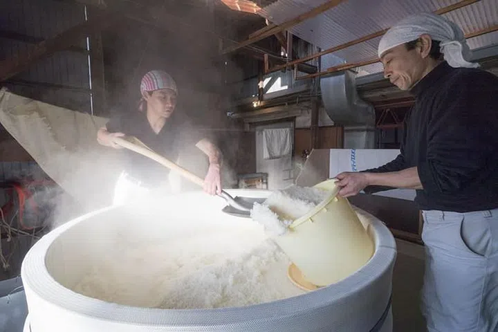 Employees at work in Fujii Shuzo Sake in Takehara. Photo: Depositphotos