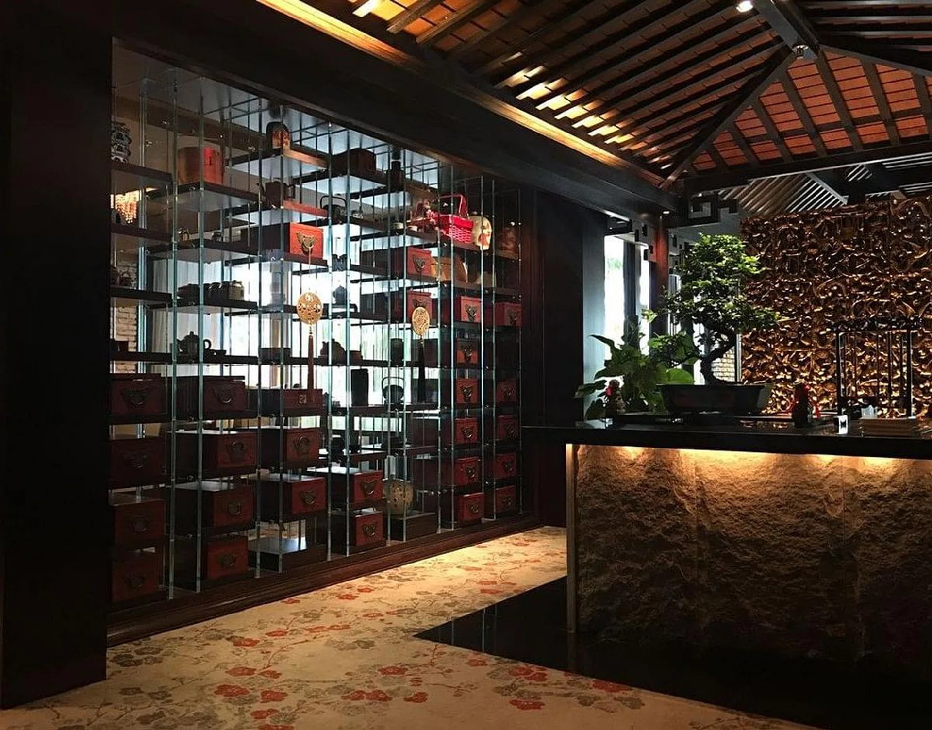 Cherry Garden is a top-tier showcase of themed restaurant decor done right. In this photo alone: bonsai trees, the right knick-knacks, a gazebo-like ceiling and even pattered carpet.