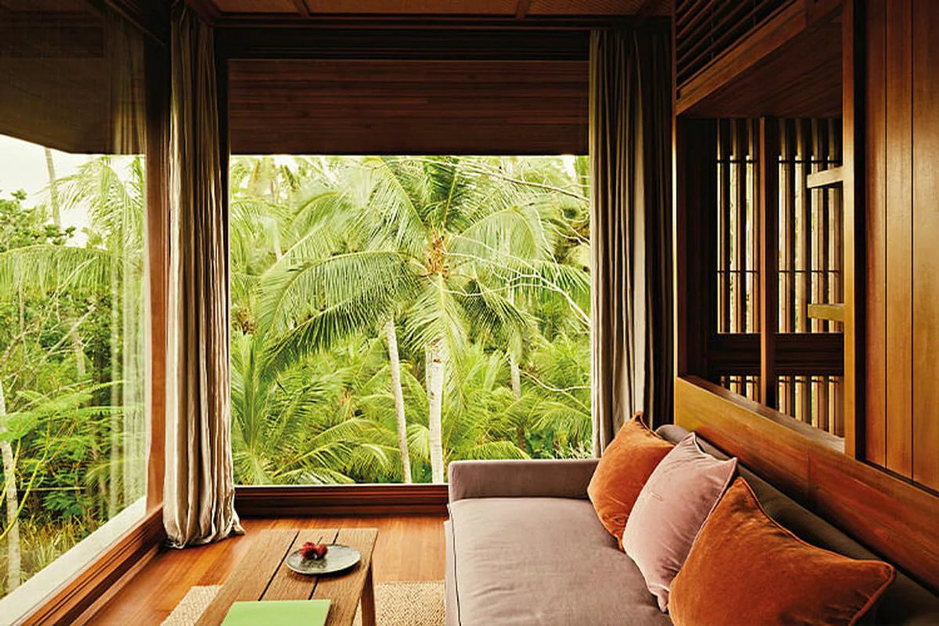 On Bali’s west coast, Lost Lindenberg offers breezy, treehouse-style rooms perched on elegant wooden towers — inviting guests to connect with the natural surroundings.