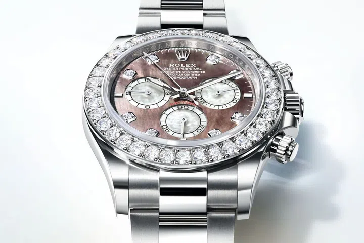 Rolex Oyster Perpetual Cosmograph Daytona in white gold with a dial featuring black and white mother-of-pearl, and set with diamonds | 10 Best Luxury Watches for Men in Singapore