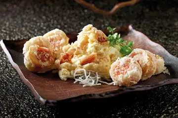 Sauteed fresh milk crab meat and egg white accompanied with deep fried pork rolls with preserved bean curd