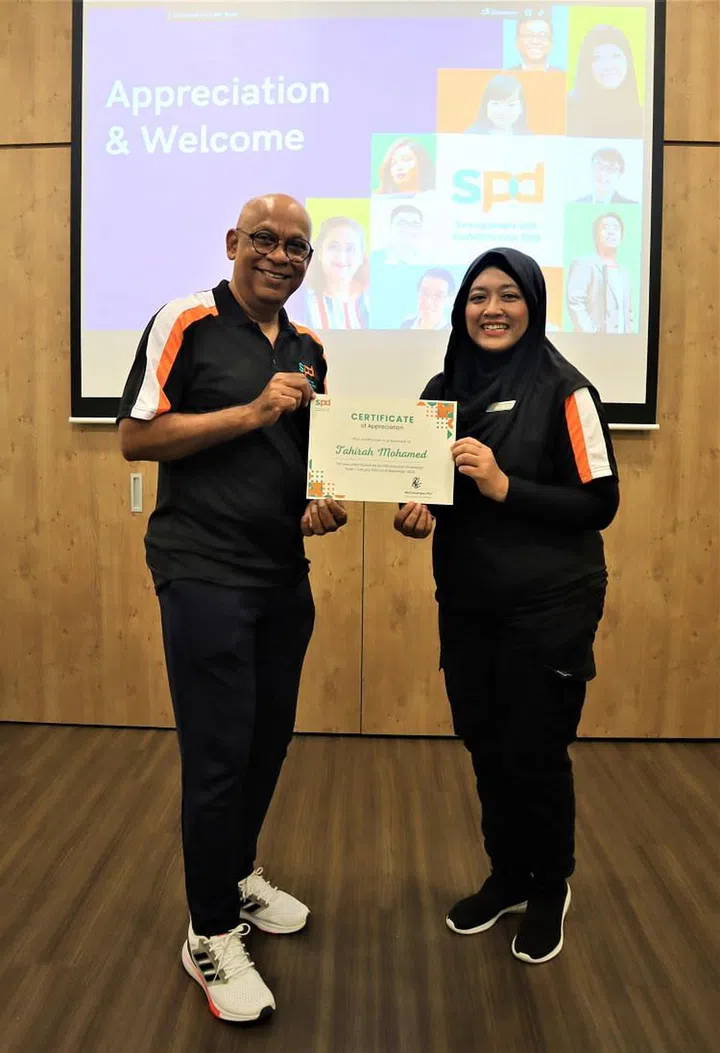 Pal with inclusion champion and caregiver Mdm Tahirah. (Photo: SPD)