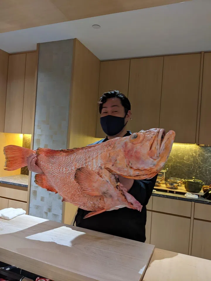 Chef Araki presents a hulking 18kg Menuke for the sashimi course. (Photo: Kenneth SZ Goh)