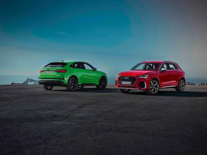 The Audi RS Q3 Sportback in Kyalami green (left) and the Audi RS Q3 in red.