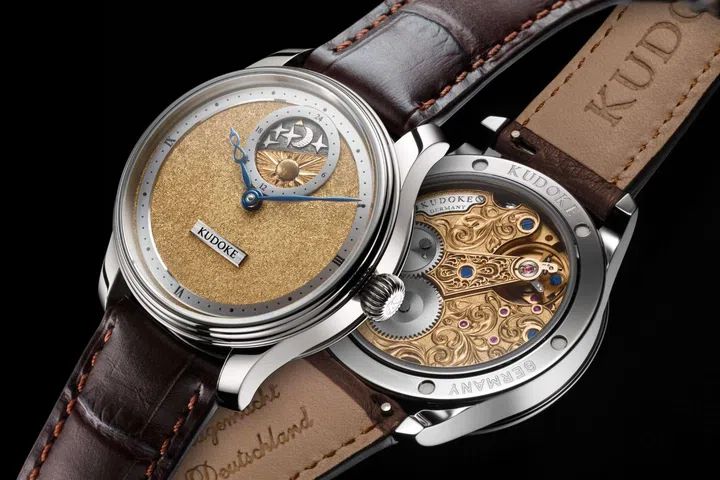 The KUDOKE 2 Tremblage in 18k rose gold, featuring a hand-engraved tremblage dial with a soft textured finish, blued steel hands, and the brand’s signature day-and-night display with sculpted sun, moon and stars at 12 o’clock.