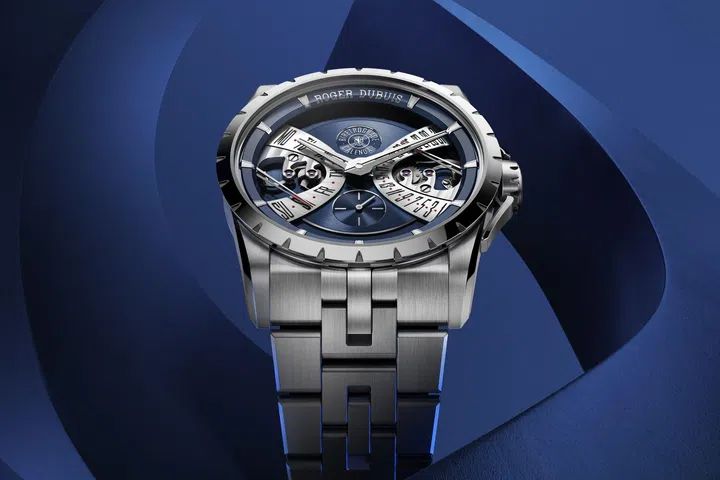Roger Dubuis Excalibur Biretrograde Calendar in a 40mm stainless steel case with a layered Cosmic Blue dial and retrograde day-date displays.