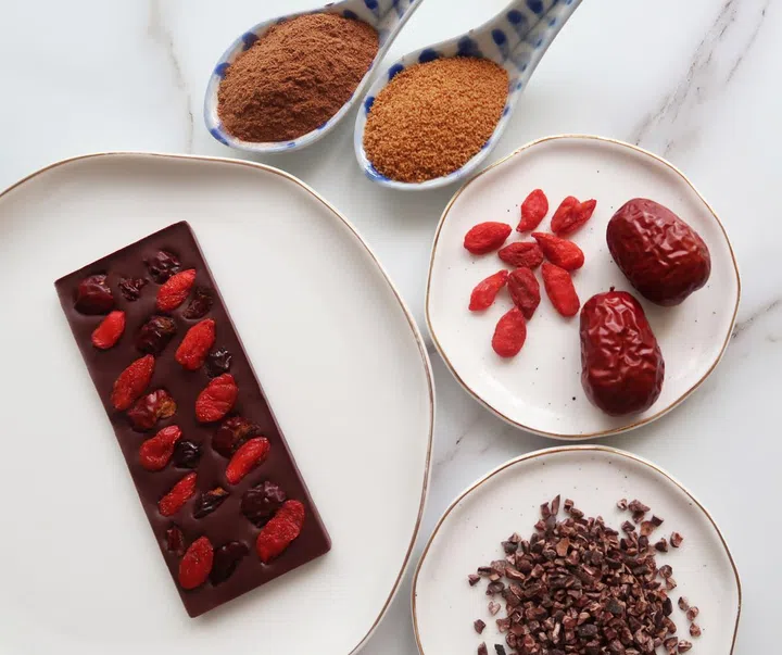 The ingredients - organic Ceylon cinnamon, organic coconut sugar, red dates and goji berries - that go into one of Happy Cioccolate's flavours, Glowy Skin.