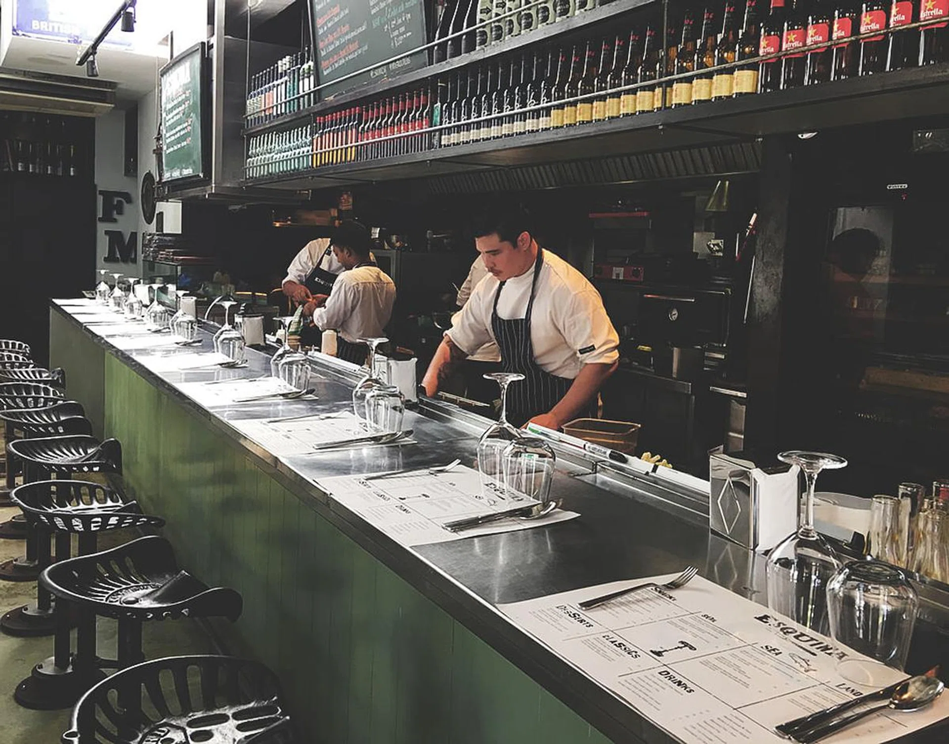 Specially designed stools made from machine parts and door knobs by a group of artists from the UK make up the bar counter seats.