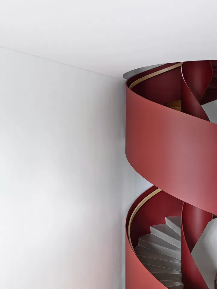 The staircase’s colour pops against the white walls. (Photo: Derek Swalwell)