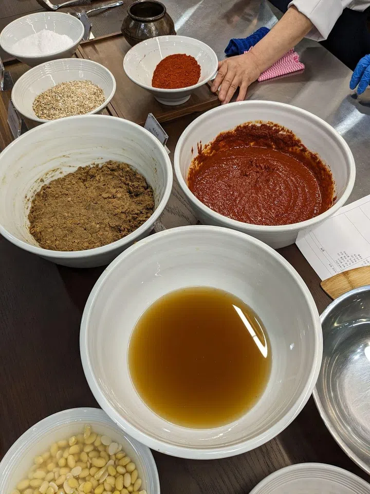 Bowls of doenjang (soybean paste), ganjang (soy sauce), and gochujang (red chilli paste). (Photo: Kenneth SZ Goh)