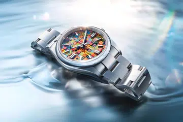 The vibrant Rolex Oyster Perpetual 36 from the Oyster’s 100th anniversary collection, with a multi-coloured Jubilee motif dial and Oystersteel bracelet.