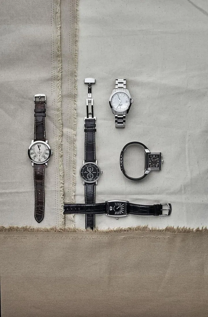 Clockwise from top right: Grand Seiko Hi-Beat 36,000 GMT, Jaeger-LeCoultre Reverso Gran'sport Duo, Gerald Genta Retro Solo, Corum Classical Heure Sautante & Chronoswiss Regulateur