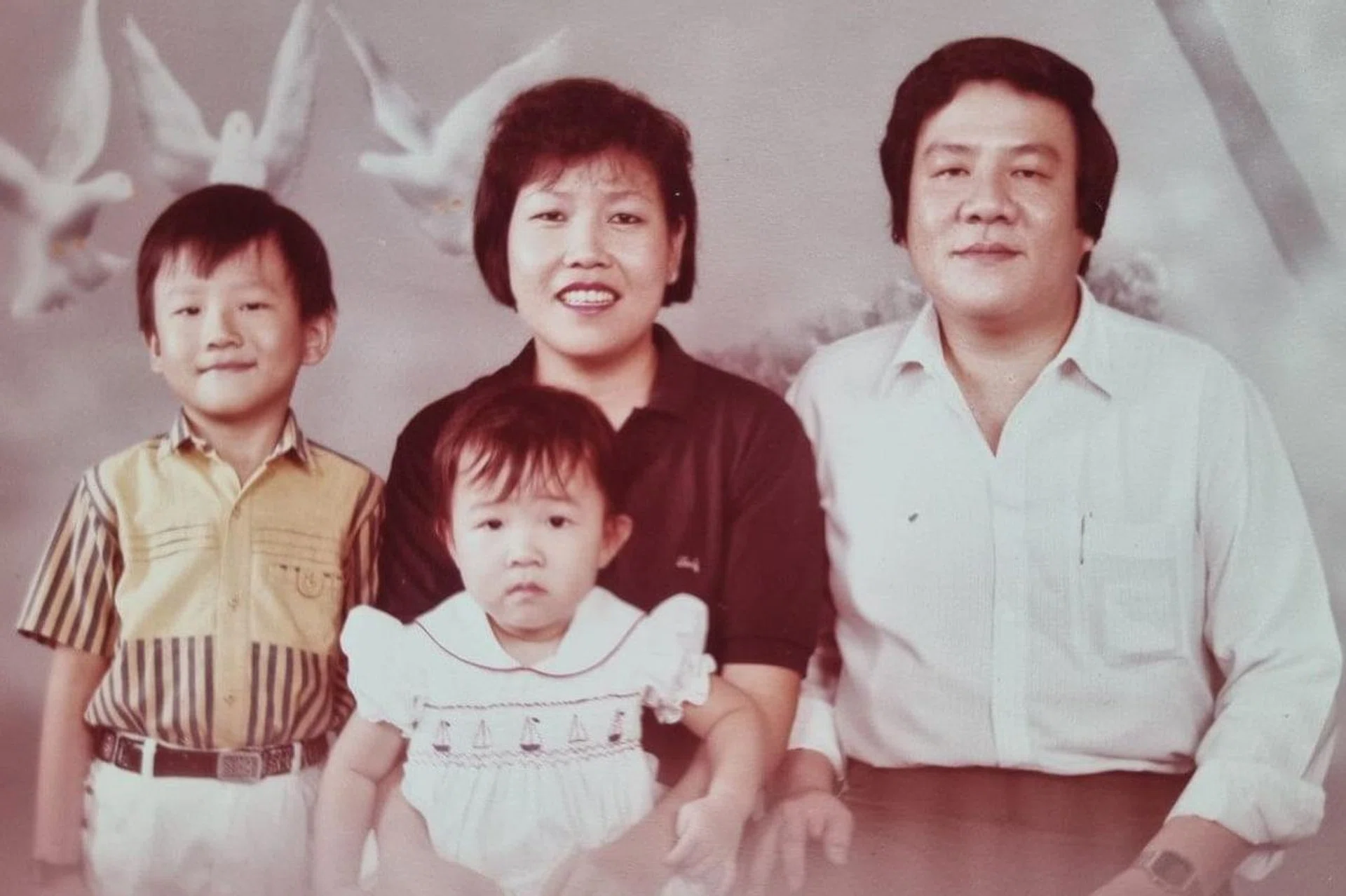 A family portrait of Martino Tan (left) with his family.