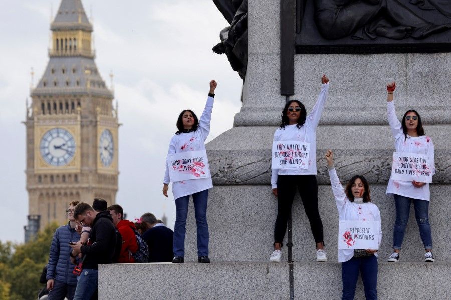 People protest following the death of Mahsa Amini in Iran, in London, Britain, 22 October 2022. (Kevin Coombs/Reuters)