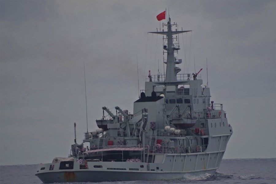 This handout photo taken on 13 July 2021 and received on 18 July from the Philippine Coast Guard shows a Chinese PLA Navy ship in the waters of Marie Louise bank, some 147 nautical miles from the shores of El Nido town, Palawan province. (Handout/Philippine Coast Guard/AFP)