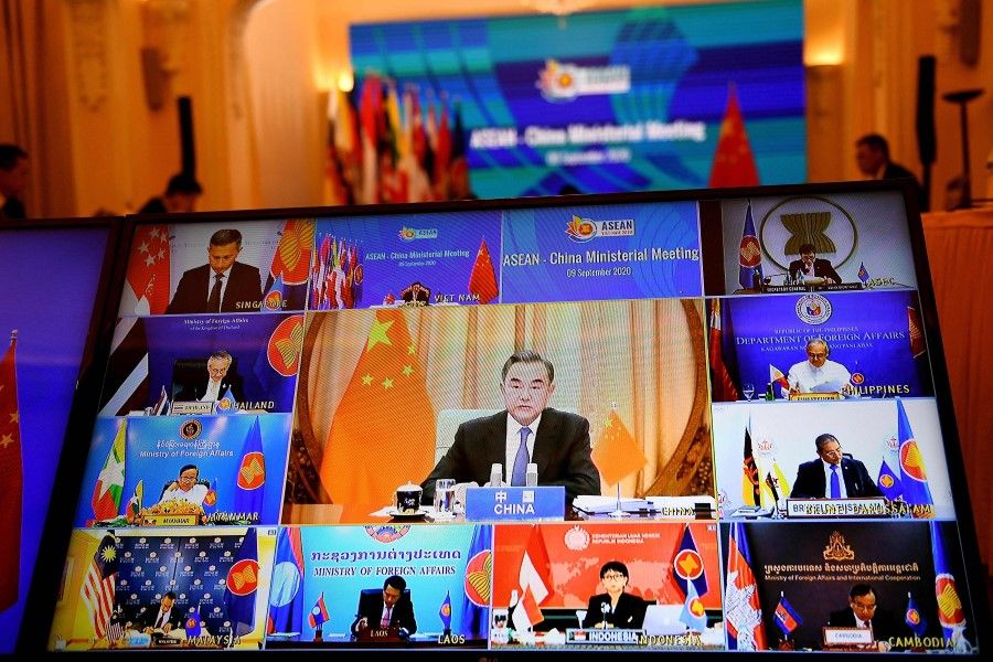 China's Foreign Minister Wang Yi (C on screen) addresses counterparts from the Association of Southeast Asian Nations (ASEAN) countries in a live video conference during the ASEAN-CHINA Ministerial Meeting, held online due to the COVID-19 novel coronavirus pandemic, in Hanoi on 9 September 2020. (Nhac Nguyen/AFP)