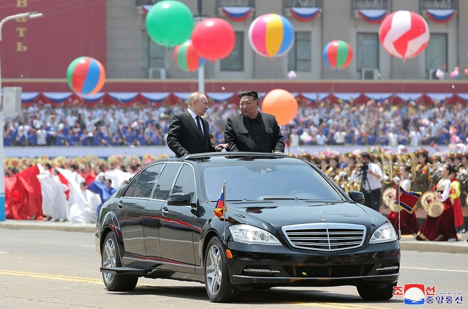 North Korea’s leader Kim Jong-un and Russia’s President Vladimir Putin parading around in an open-top car during a welcoming ceremony at Kim Il Sung Square in Pyongyang. Putin signed a mutual defence agreement on 19 June with North Korea’s Kim, who offered his “full support” on Ukraine.  (KCNA via KNS/AFP)