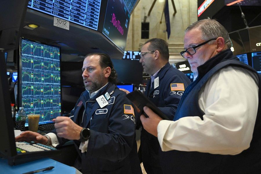 Traders work on the floor of the New York Stock Exchange during morning trading on 4 March 2024 in New York City. (Angela Weiss/AFP)