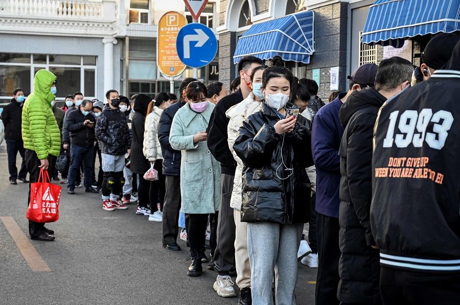 People line up to be tested for Covid-19 outside a hospital in Beijing, China, on 12 November 2021. (Jade Gao/AFP)