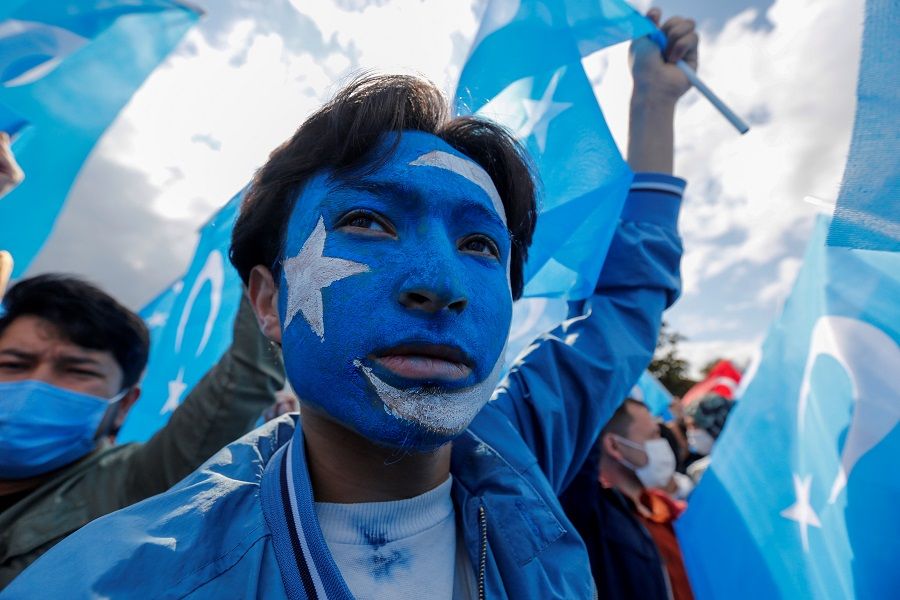 Ethnic Uighur demonstrators take part in a protest against China, in Istanbul, Turkey, 1 October 2021. (Dilara Senkaya/Reuters)
