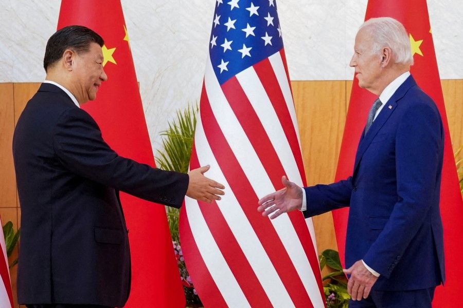US President Joe Biden meets with Chinese President Xi Jinping on the sidelines of the G20 leaders' summit in Bali, Indonesia, 14 November 2022. (Kevin Lamarque/Reuters)