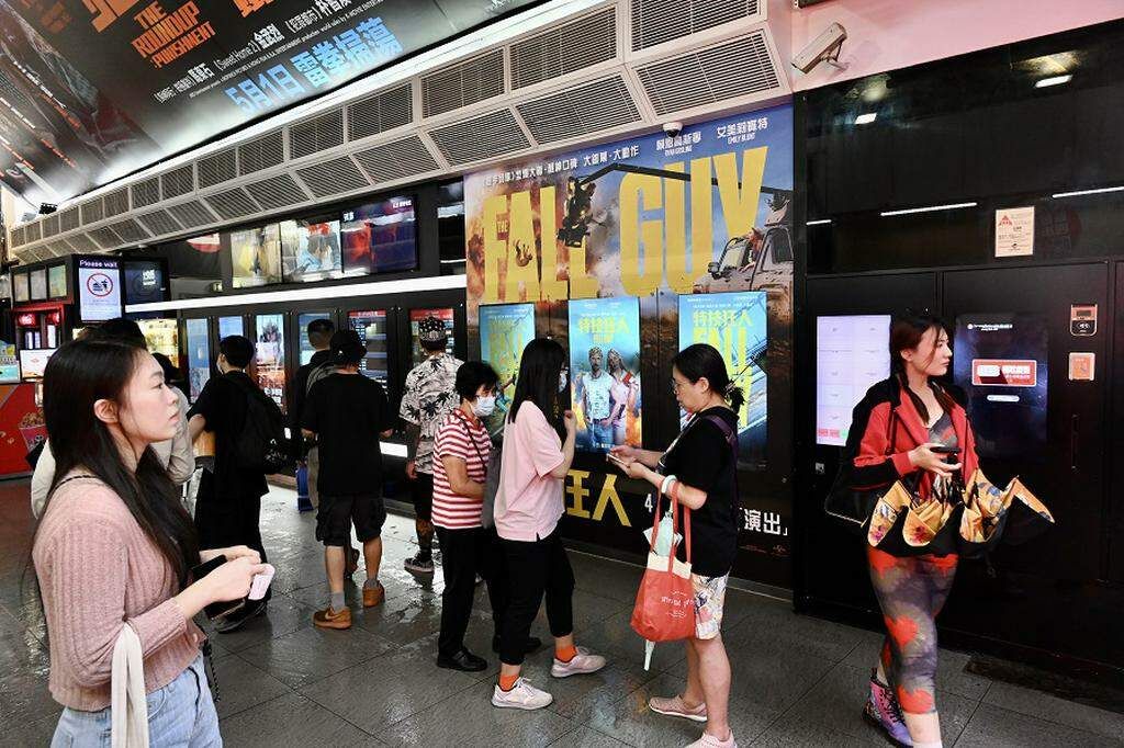 How should the Hong Kong film industry overcome its difficulties?