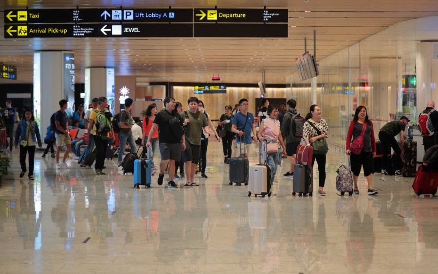 Travellers arriving at Changi Airport from Wuhan need to undergo temperature screenings following a pneumonia outbreak. (SPH)