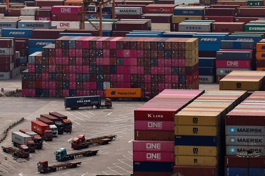 A truck carrying a container moves at the Yantian port in Shenzhen, Guangdong province, China, on 17 April 2025. (Tingshu Wang/Reuters)