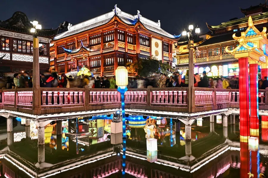 People visit the Yu Garden in Shanghai, China, on 15 February 2022. (Hector Retamal/AFP)