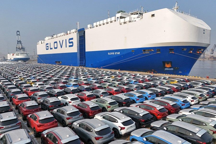 This file photo taken on 2 January 2024 shows cars waiting to be loaded onto a ship for export at the port in Yantai, in China's eastern Shandong province. (AFP)
