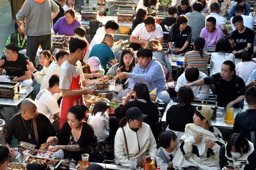 A crowd of people eating barbecue in Zibo, Shandong, 30 April 2023. (CNS)