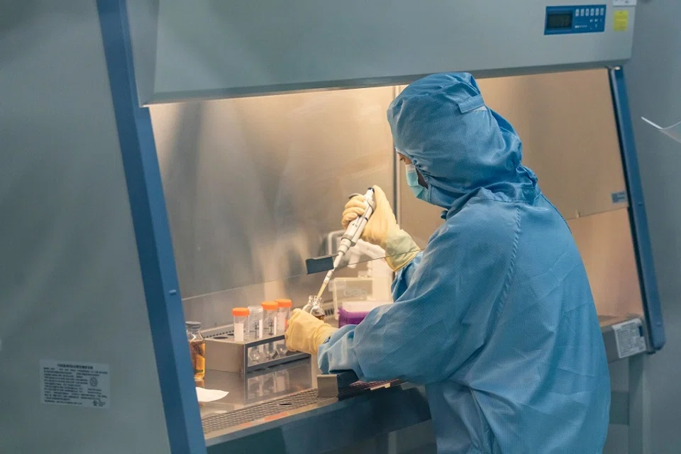 A technician works inside a production laboratory for CAR-T cell therapies at the IASO Biotechnology Co. facility in Nanjing, China, on 9 June 2025. The company develops blood tumour cell drugs, antibody drugs and other related drugs. (Qilai Shen/Bloomberg)