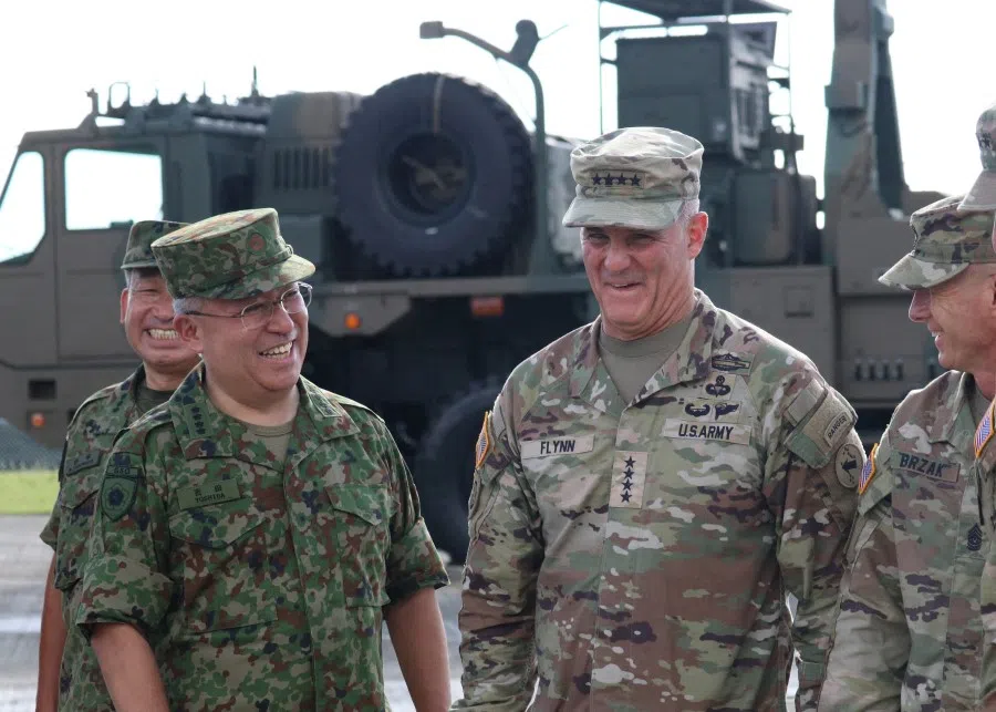General Charles A. Flynn, Commanding General, US Army Pacific (USARPAC) (right) reacts with General Yoshida Yoshihide, Ground Self-Defense Force Chief of Staff at a Ground Self-Defense Force base on Amami Oshima island, Kagoshima Prefecture, Japan, 8 September 2022. (Tim Kelly/Reuters)