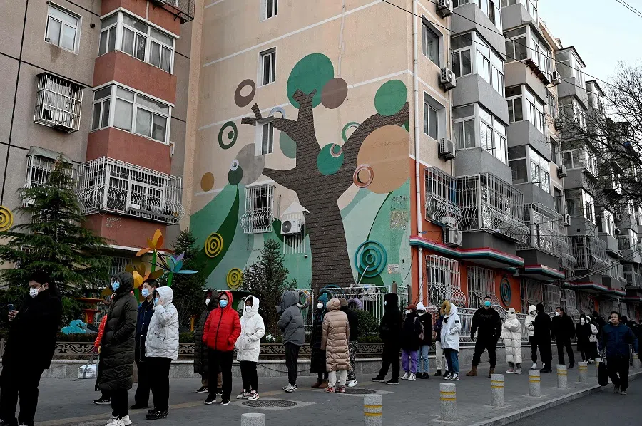 People wait in a long queue to be tested for Covid-19 at a nucleic acid testing site in Beijing, China, 3 December 2022. (Jade Gao/AFP)