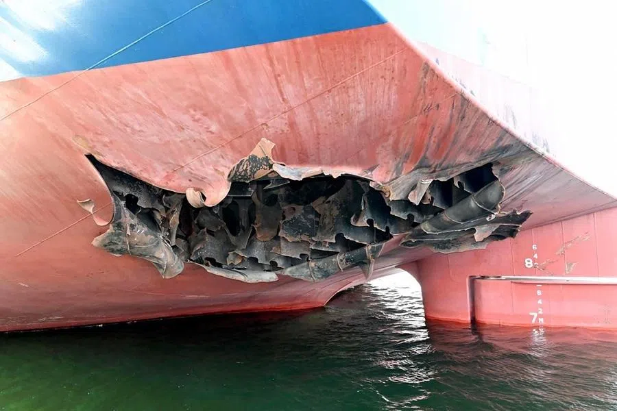 This undated handout photograph released by South Korea's Foreign Ministry on 10 May 2026, shows a damaged part of the South Korean cargo ship HMM Namu docked at a port in Dubai. (Handout/South Korean Foreign Ministry/AFP)
