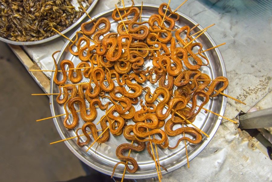 Grilled snakes at a street market in China. (iStock)