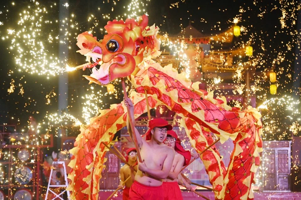 Dragon dancers perform at a park on the first day of the Lunar New Year of the Dragon in Beijing on 10 February 2024. (Greg Baker/AFP)