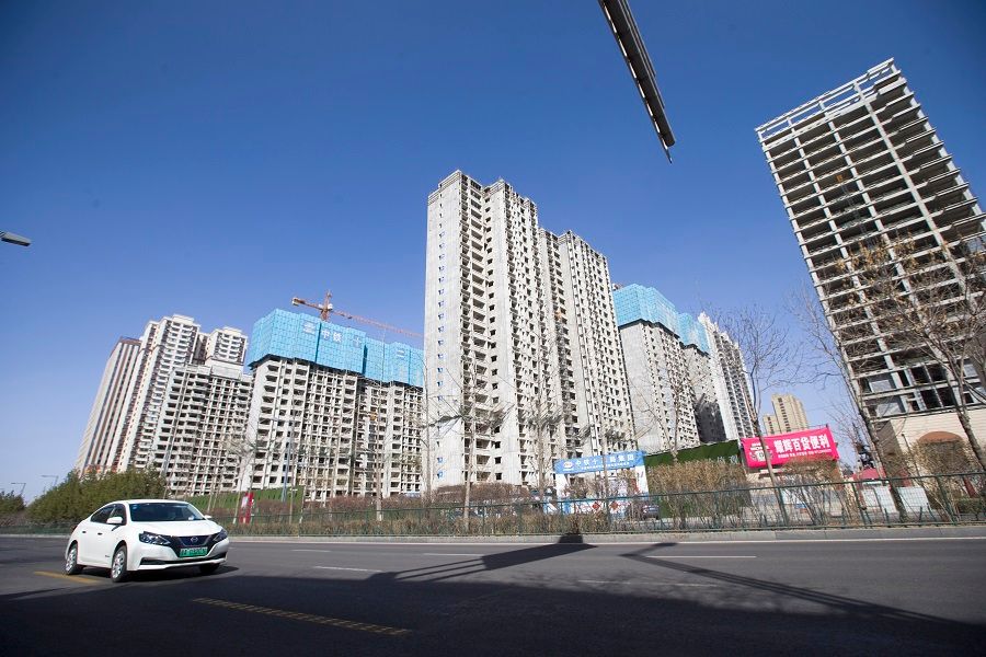 A car drives past a building under construction in Taiyuan, Shanxi province, China, 15 March 2022. (CNS)