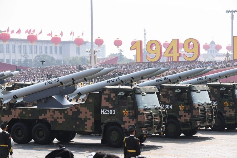In this file photo taken on 1 October 2019, military vehicles carrying HHQ-9B surface-to-air missiles participate in a military parade at Tiananmen Square in Beijing, to mark the 70th anniversary of the founding of the People's Republic of China.(Greg Baker/AFP)