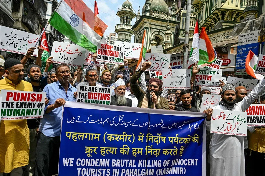 Demonstrators holding posters shout slogans during a protest to condemn the terror attack in Pahalgam, in Mumbai, India, on 25 April 2025. (Indranil Mukherjee/AFP)