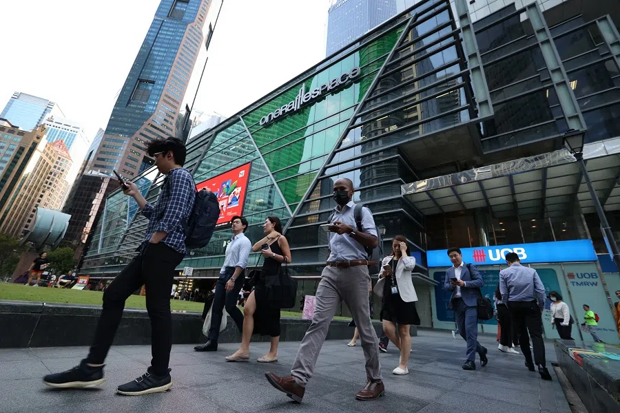 People walking in Singapore's central business district, on 13 March 2024. (SPH)