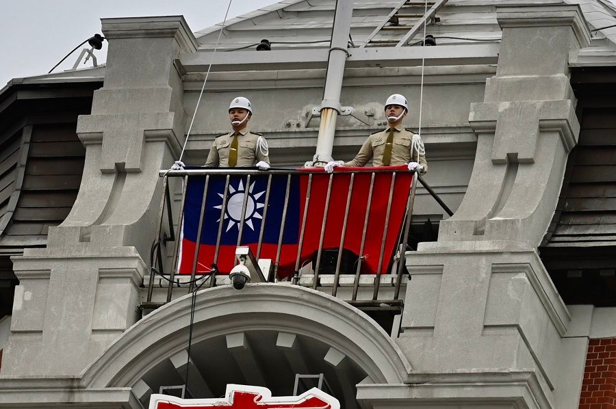 In this file photo, Taiwan's military police prepare to raise the Taiwanese flag during a ceremony to mark Taiwan's Double Ten Day at the Presidential Office in Taipei on 10 October 2020. (Sam Yeh/AFP)