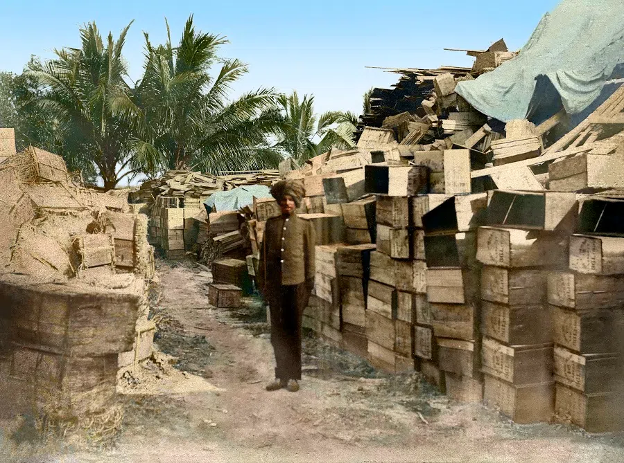 An Indian worker in charge of wooden crates, 1900s.
