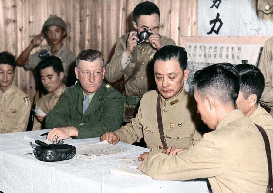 On 21 August 1945, chief of staff of the Chinese Army Xiao Yisu (centre) calling on the Japanese representative to proceed immediately with the surrender in accordance with instructions from the Japanese emperor, and to hand over a list of Japanese soldiers in China. On the left is the US chief of staff of Chinese Combat Command Haydon L. Boatner.
