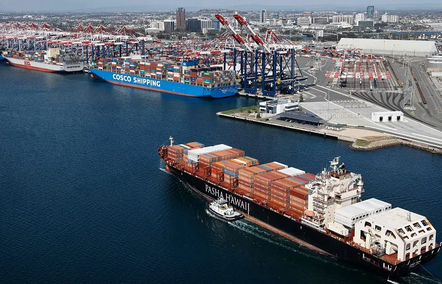 An aerial view of a Pasha Hawaii container ship arriving in the Port of Long Beach near a Cosco Shipping container ship on 3 April 2025 in Long Beach, California.