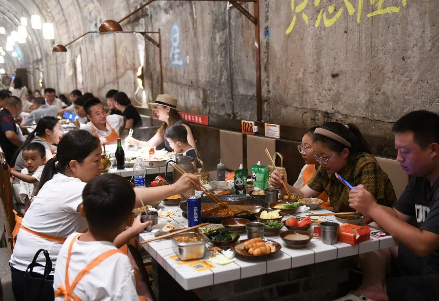People eat hotpot at an underground hotpot restaurant in Chongqing, China, 15 August 2024. (CNS)