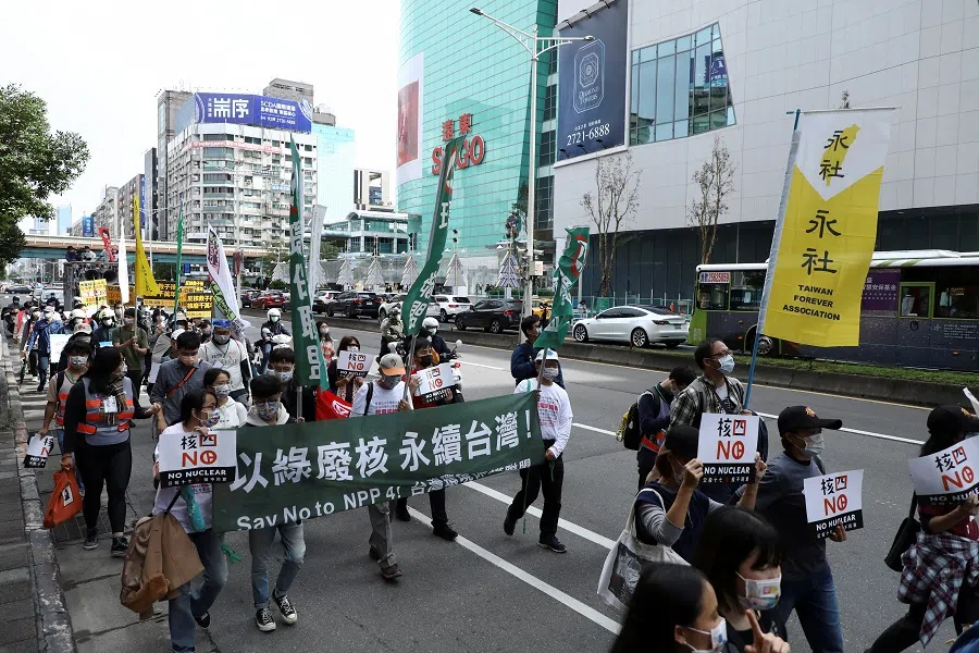 Demonstrators take part in a march against nuclear power ahead of a referendum on whether the government should continue building the stalled Fourth Nuclear Power Plant, in Taipei, Taiwan, 5 December 2021. (Annabelle Chih/Reuters)