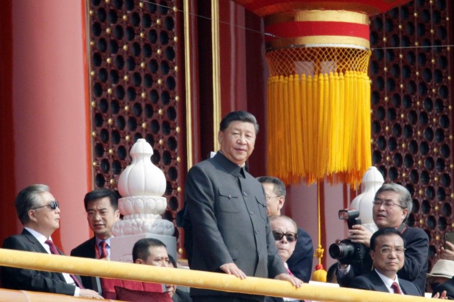 Chinese President Xi Jinping stands near former Chinese presidents Hu Jintao, Jiang Zemin and Premier Li Keqiang on Tiananmen Gate during the military parade marking the 70th founding anniversary of People's Republic of China, on its National Day in Beijing, China, 1 October 2019. (Jason Lee/Reuters)