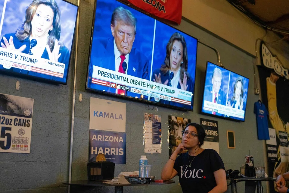 A supporter of Vice President and Democratic presidential candidate Kamala Harris attends a watch party for the US Presidential debate between Harris and former US President and Republican presidential candidate Donald Trump at American Eat Co. in Tucson, Arizona, on 10 September 2024. 