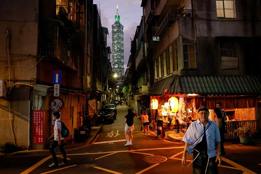 People walk as the Taipei 101 building is seen in the distance, ahead of Taiwan's National Day celebrations in Taipei, Taiwan, 9 October 2025. (Ann Wang/Reuters)